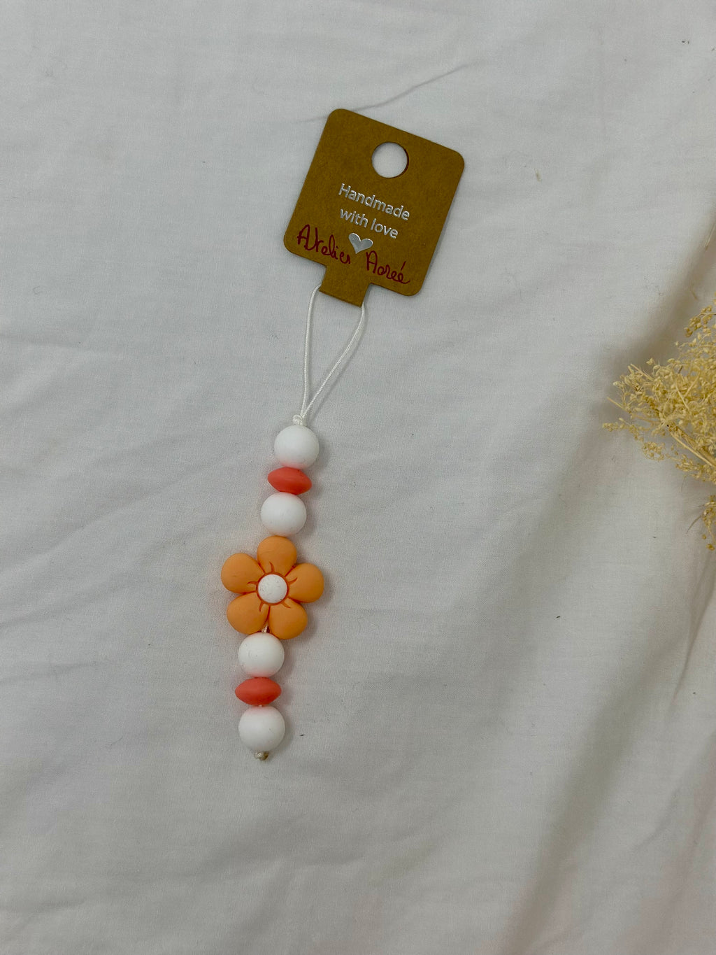 Bijou téléphone pêche 14cm couleur croquante perles oranges Atelier Aorée
