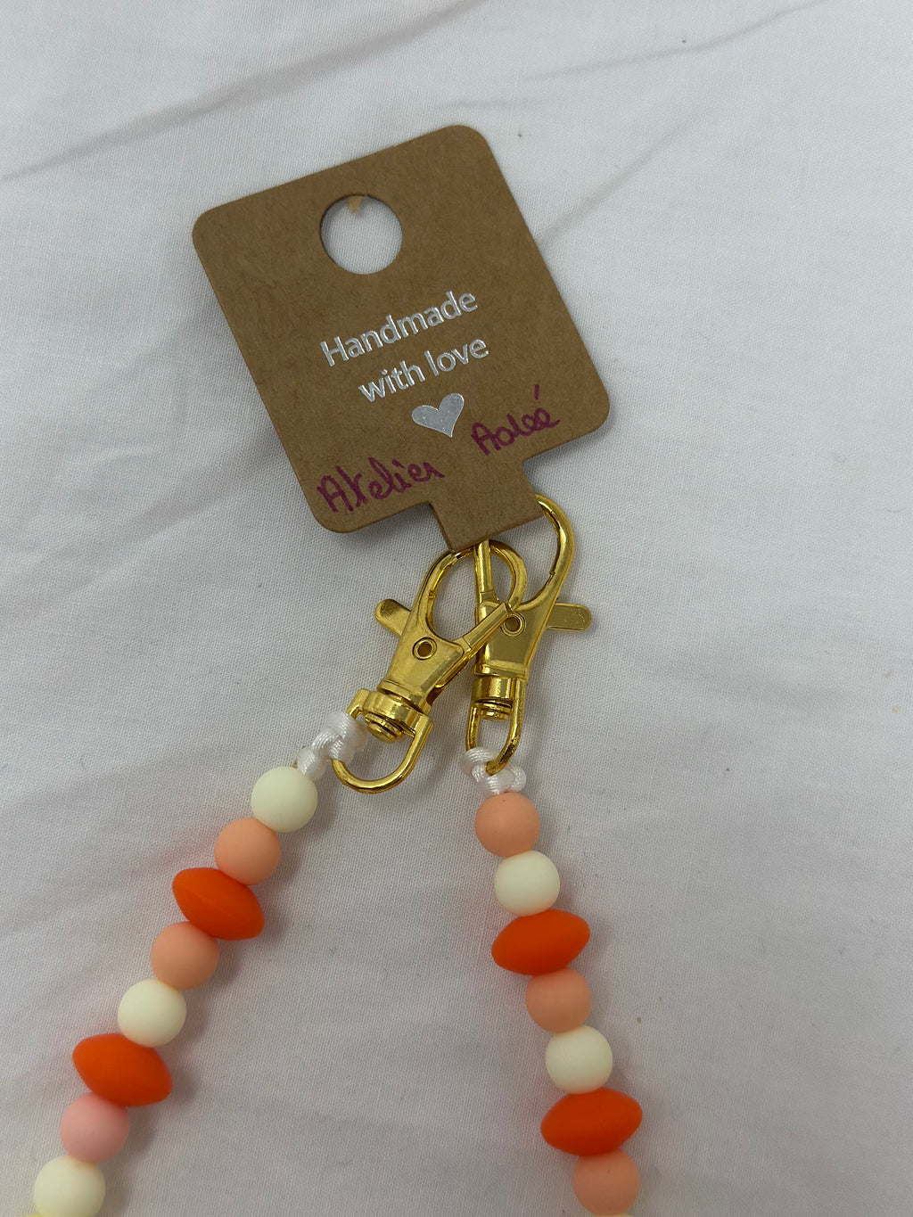 Bijou chaîne téléphone doré 36cm rayon soleil perles dorées Atelier Aorée
