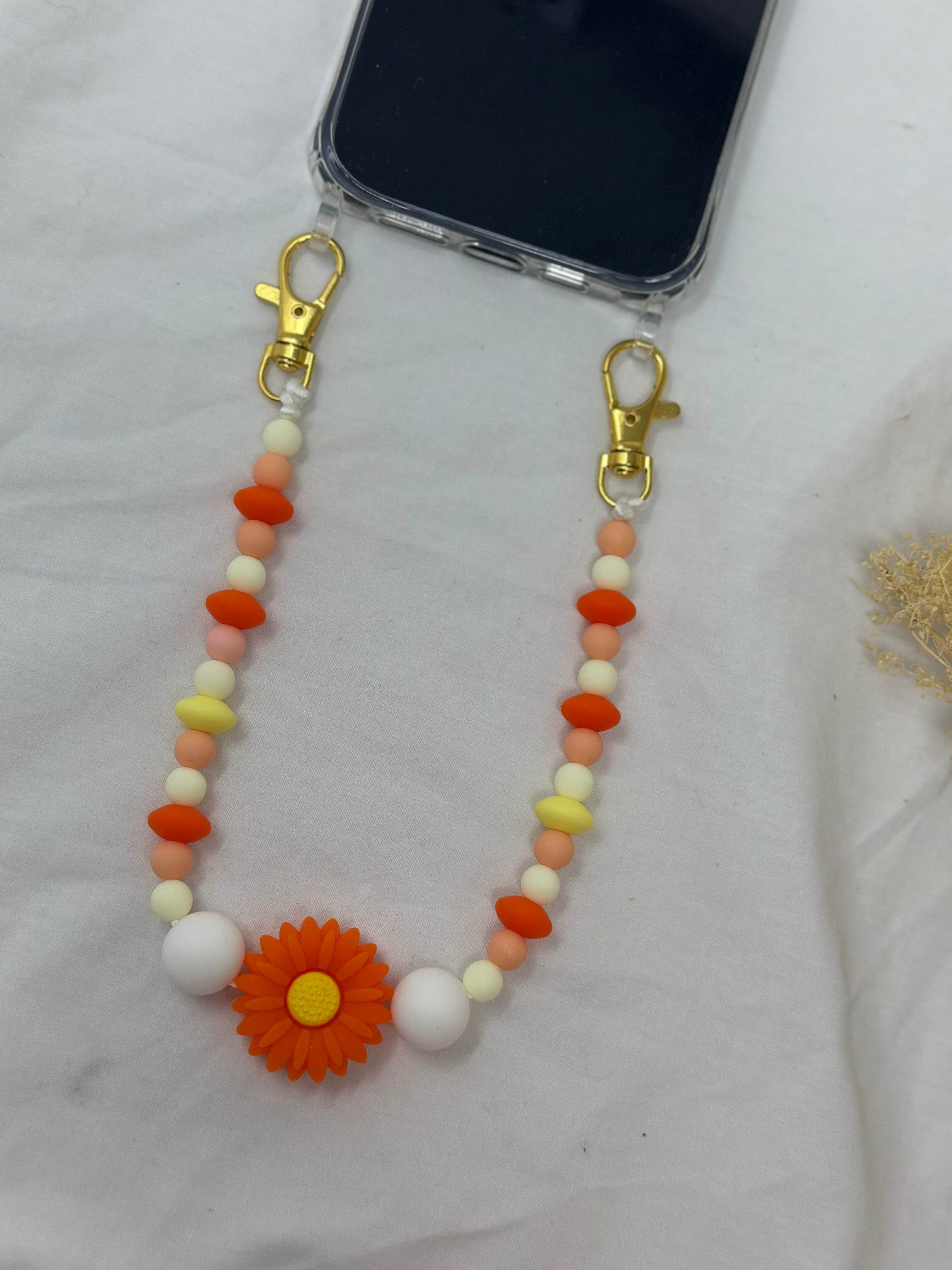 Bijou chaîne téléphone doré 36cm rayon soleil perles dorées Atelier Aorée
