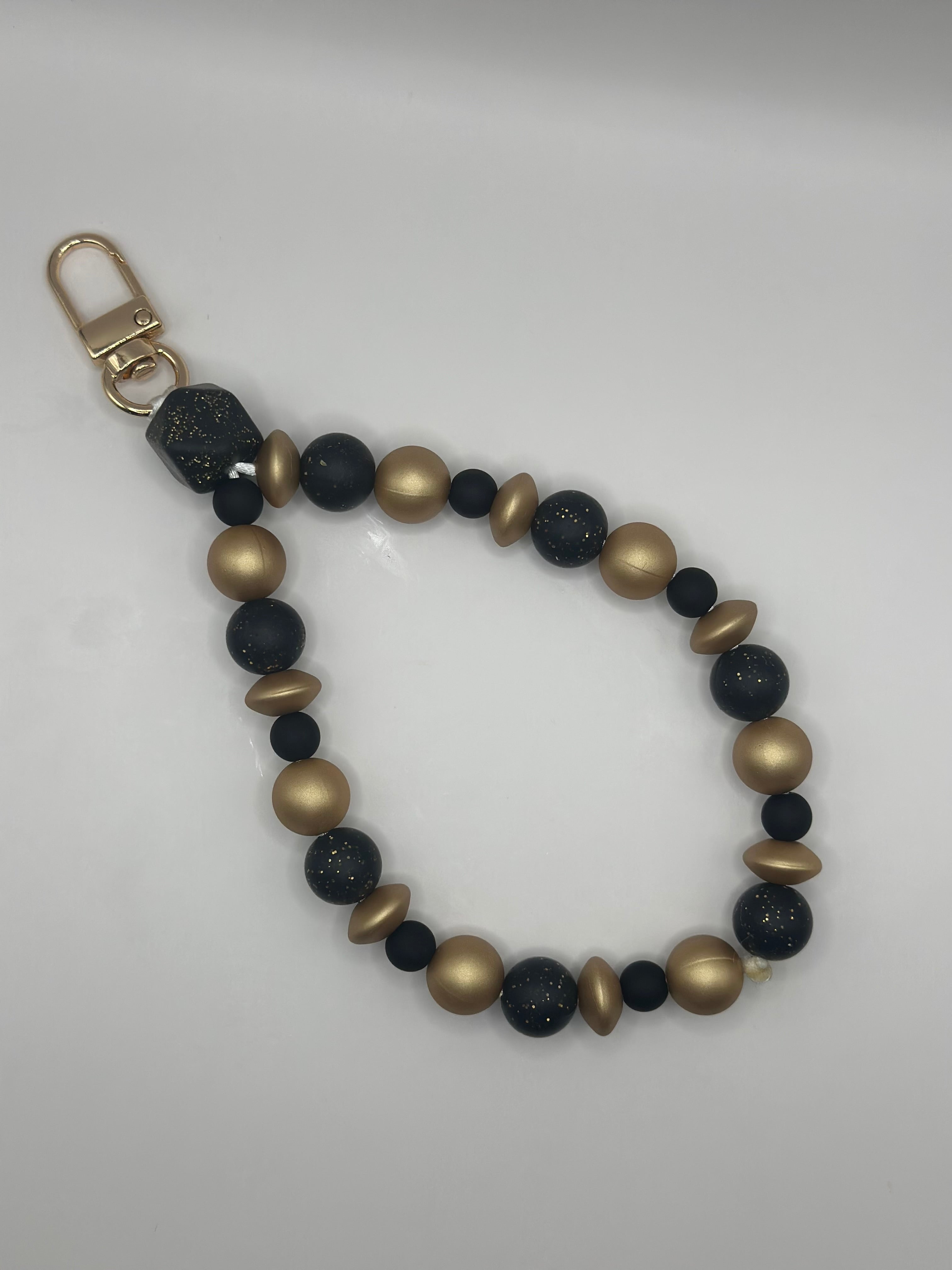 Bijou Téléphone Noir et Doré Élégant - Fait Main France | Atelier Aorée